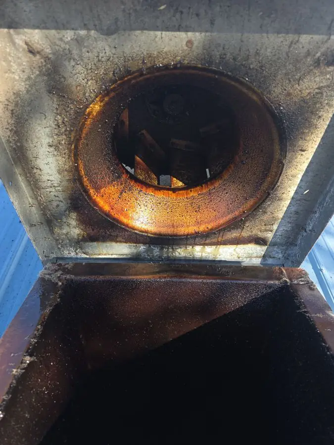 Rooftop kitchen exhaust fan before cleaning