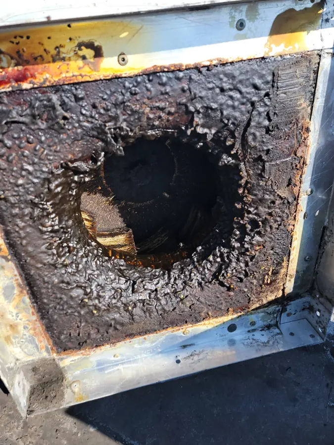 Rooftop upblast exhaust fan before cleaning